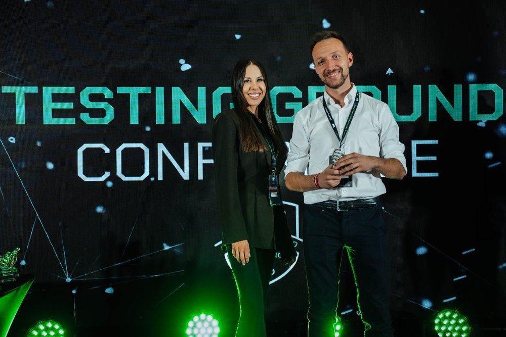 Testing Ground Conference 2025, award presented on stage